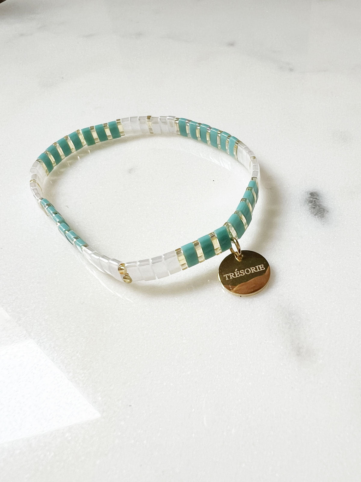 Glass deep aqua-white-gold