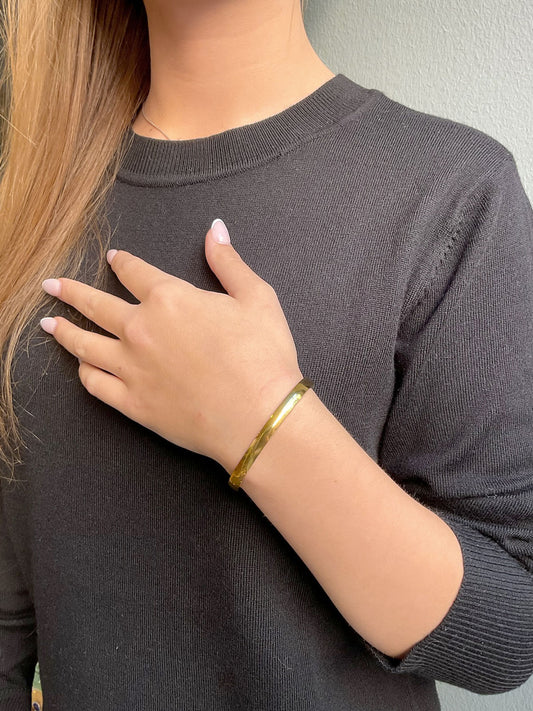 Sleek steel bangle gold