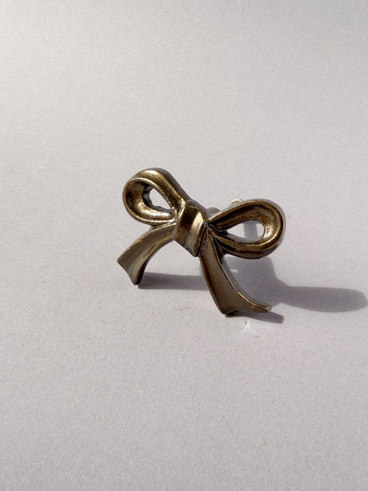Cast iron knob bow aged brass