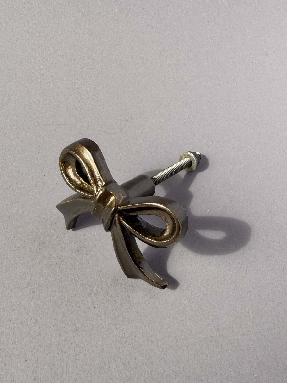 Cast iron knob bow aged brass
